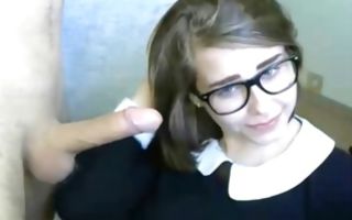 Geeky whore is on her knees getting face covered in cum